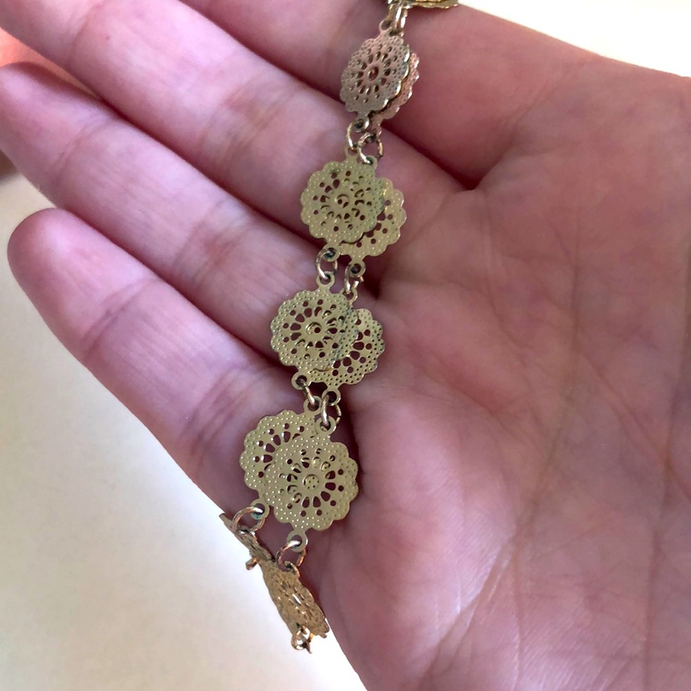 Choker necklace with flower design.